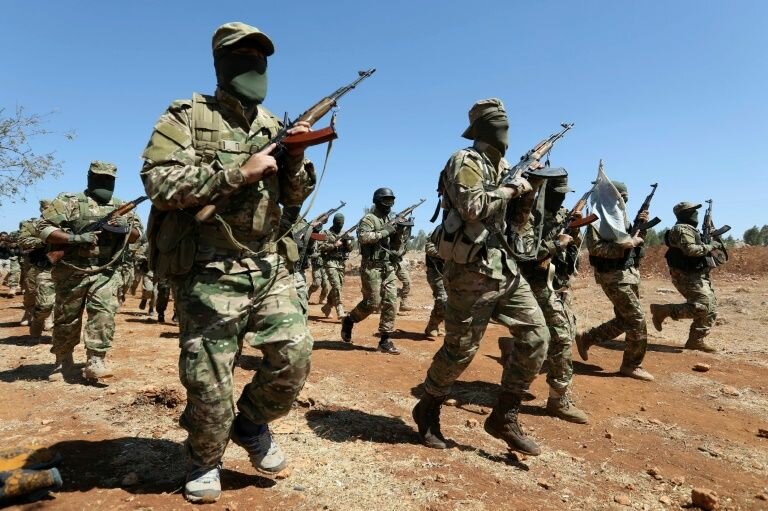 مقاتلون من هيئة تحرير الشام خلال معسكر تدريب في محافظة إدلب - 14 آب 2018